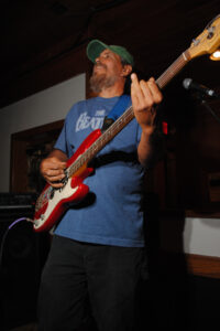 John 'Catfish' Juliano on bass guitar